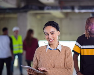 young multiethnic business couple on construction site