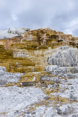 Fototapeta na wymiar White and orange deposits at Yellowstone.