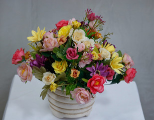 bouquet of roses in a vase on white background