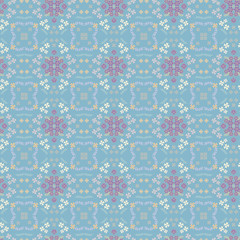 Beautiful vector floral pattern with pastel flowers on a gentle blue background.
