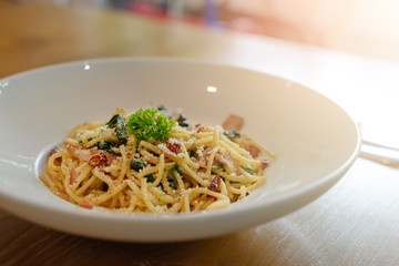 Delicious spicy spaghetti with bacon, dried chilli, basil and garlic