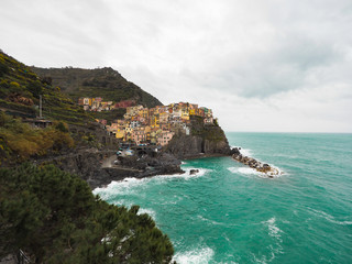 Fototapeta na wymiar Manarola beautiful seaside town of Italy on a stormy day.