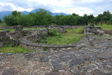 Ruins of ancient greek city Dion with olympic mountains on the background