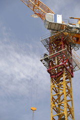 Tower crane soars into blue sky