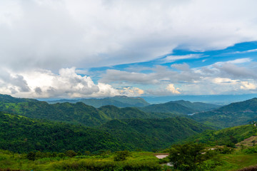 Obraz premium Blue sky high peak mountains fog hills mist scenery national park views at Phu Tub Berk, Khao Koh, Phetchabun Province, Thailand