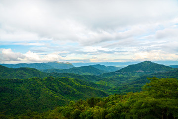 Naklejka premium Blue sky high peak mountains fog hills mist scenery national park views at Phu Tub Berk, Khao Koh, Phetchabun Province, Thailand