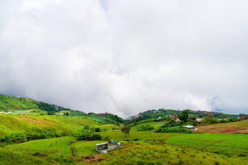 Blue sky high peak mountains fog hills mist scenery national park views at Phu Tub Berk, Khao Koh, Phetchabun Province, Thailand