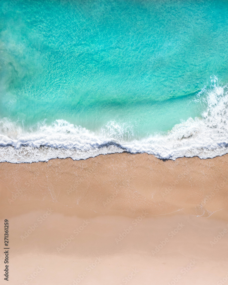 Wall mural aerial top shot of a beach with nice sand, blue turquoise water and tropical vibe - Wall murals