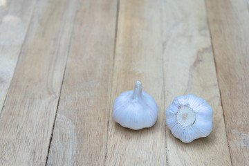 Top view of herbal vegetable ingredients, fresh garlic, on old wooden table, cooking preparation concept