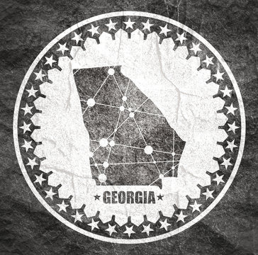 Image relative to USA travel. Georgia state map textured by lines and dots pattern. Stamp in the shape of a circle