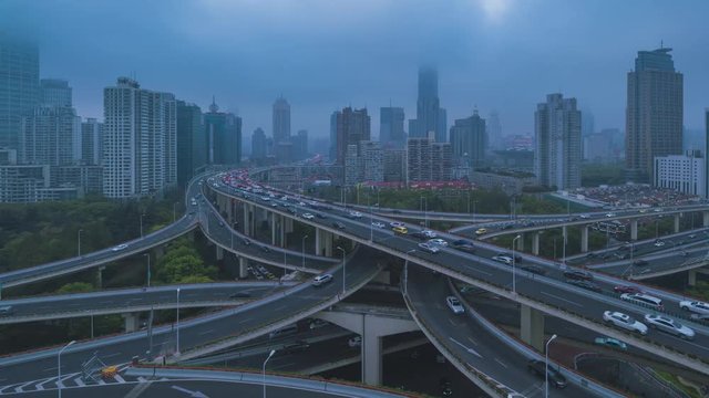 4k time lapse video with pan left to right camera movement of highway crowed traffic at day to night in Shanghai