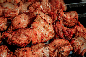 pork shish kebab on skewers. marinated meat. meat kebab. skewers on skewers. cooking on fire.