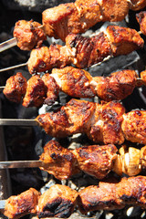 pork shish kebab on skewers. marinated meat. meat kebab. skewers on skewers. cooking on fire.