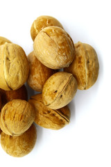Walnuts are placed on a white background. Food for vegetarians, raw foodists, as well as for those who lead a healthy lifestyle and take care of their health