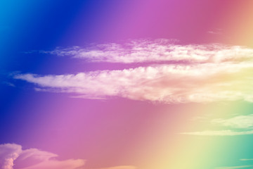 A soft fog cloud background with pastel colored orange to blue gradient, rainbow onthe sky
