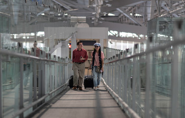 Travels performs elderly in retirement in the airport. Experienced travel tickets booking airline. waiting and delays 