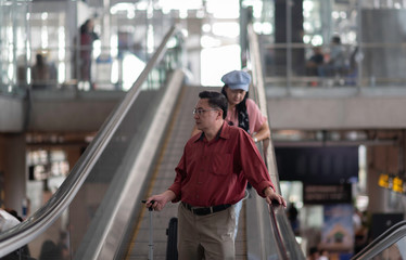 Travels performs elderly in retirement in the airport. Experienced travel tickets booking airline. waiting and delays 