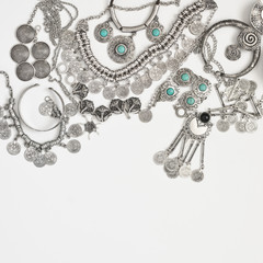 Bohemian style silver jewelry on white