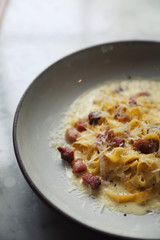 fettuccine carbonara , fettuccine pasta spaghetti with bacon ham and mushroon in white sauce italian food