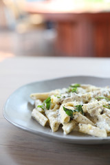 Penne pasta with white sauce and truffle , italian food