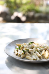 Penne pasta with white sauce and truffle , italian food