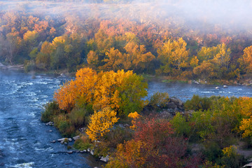 View of Southern Bug River and rocks at calm autumn morning in reserve Buzsky Gard, Migeya, Mykolaiv region, Ukraine. View from above