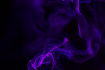 Colorful smoke close-up on a black background