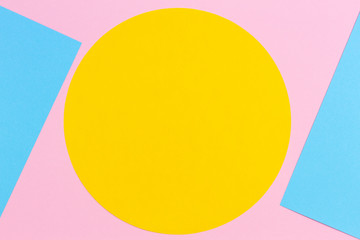 Texture background of fashion papers in memphis geometry style. Yellow, light blue and pastel pink colors. Top view, flat lay