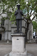 Fototapeta na wymiar London, England, UK. Statue: Air Field Marshal Lord Downing in front of Church of St Clement Danes