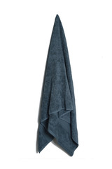 soft cotton bath towel hanging over beautiful background. Color and color cotton towel isolated.