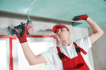 gypsum plasterboard construction work at suspended ceiling