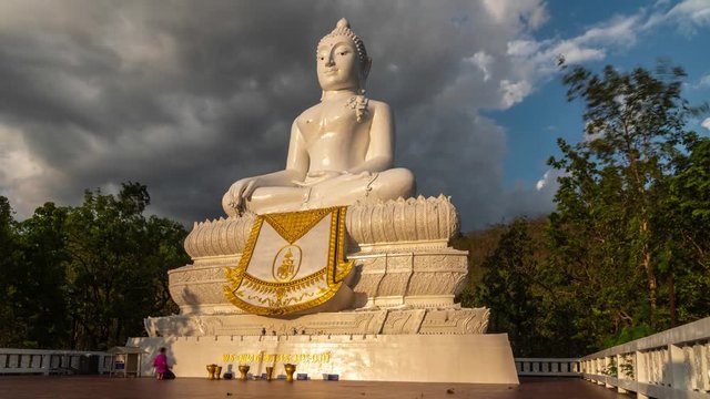 timelapse of the Wat Phra That Mae Yen big Buddha in Pai, Thailand with dramatic cloudy sky
