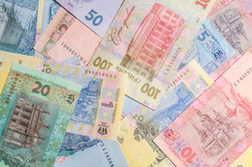 Ukrainian money. Hryvnia paper bill. Notes in denominations of one, two, five, ten, twenty, fifty and one hundred hryvnia. Cash. Background texture.