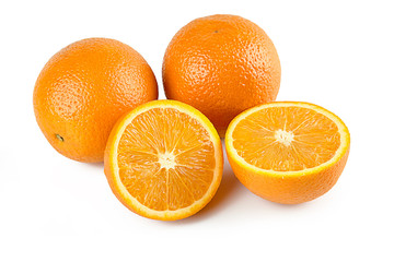 Composition of two oranges and half orange fruit isolated on white background with clipping path. Perfectly retouched. ready-to-use food images.