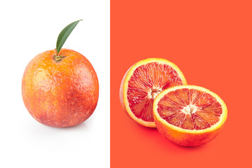 Creative poster with halfed and sicilian orange isolated on white and living coral background. Copy...