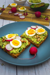 Sandwiches with avocado guacamole  fresh radish and boiled egg