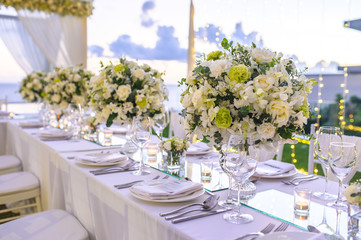 Table setting at a luxury wedding and Beautiful flowers on the table. - 271372890