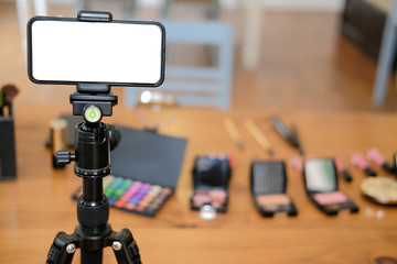 cosmetic & smartphone for recording video on beauty blogger table
