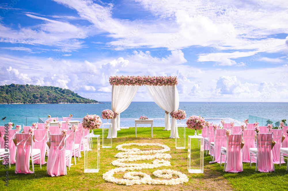 Wall mural romantic wedding ceremony on the lawn sea view.