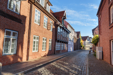 Street with Medieval old brick buildings. Luneburg. Germany