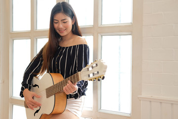 woman playing guitar. leisure lifestyle concept