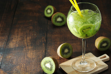 A glass with kiwi cocktail