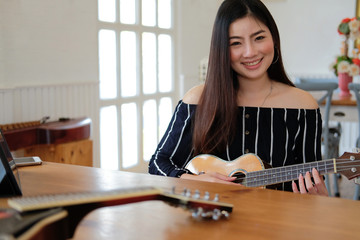 woman playing guitar. leisure lifestyle concept