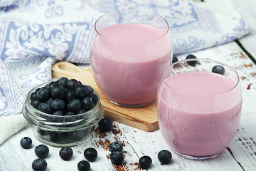 Two glasses with blueberry yogurt