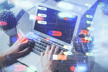 Multi exposure of technology hologram with man working on computer background. Concept of big data.