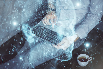 Fototapeta premium Businessman with computer background with brain theme hologram. Concept of brainstorm. Multi exposure.