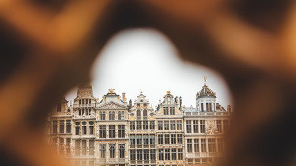 Fototapeta na wymiar View of Grand Place in Brussels through a hole in the traditional Belgian waffle.