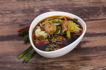 Thai style soup with meat and mushrooms