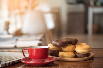 Coffee cup and small tree decorate on wooden table with copy space. Background banner for coffee lover.