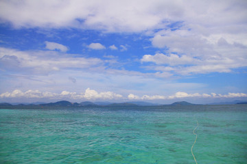 Emerald sea with blue sky and cloud on a good day.